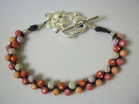 Braided waxed linen bracelet with fireball beads. - Seahawk Jewellery & Whatnot